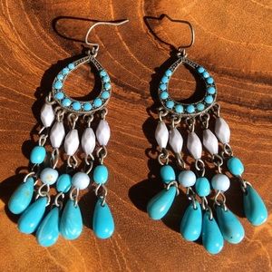 Silver chandelier southwestern themed earrings, light blue and turquoise hues.